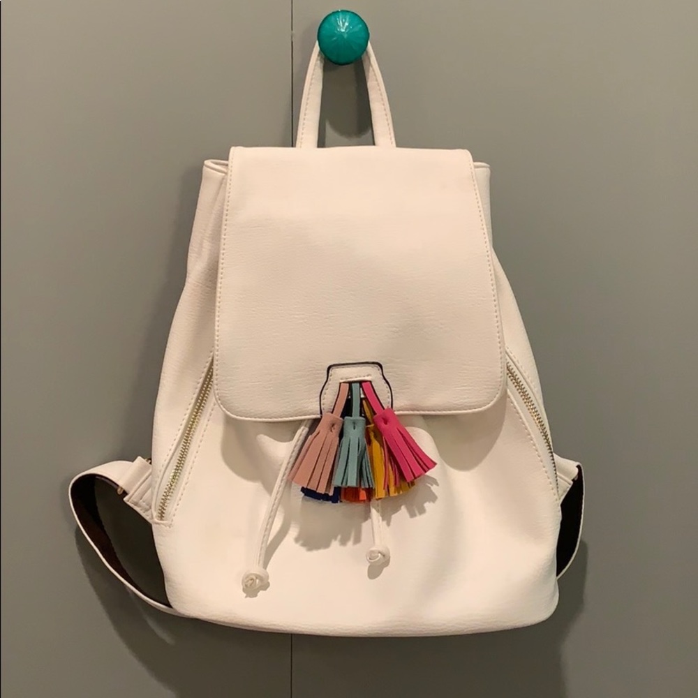 White leather backpack with multi-color tassel